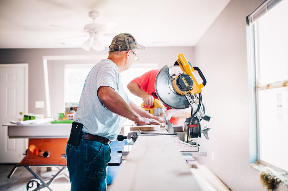 Man working miter saw - Contractors Liability