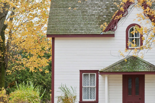 Front view of home on fall day - Home Insurance